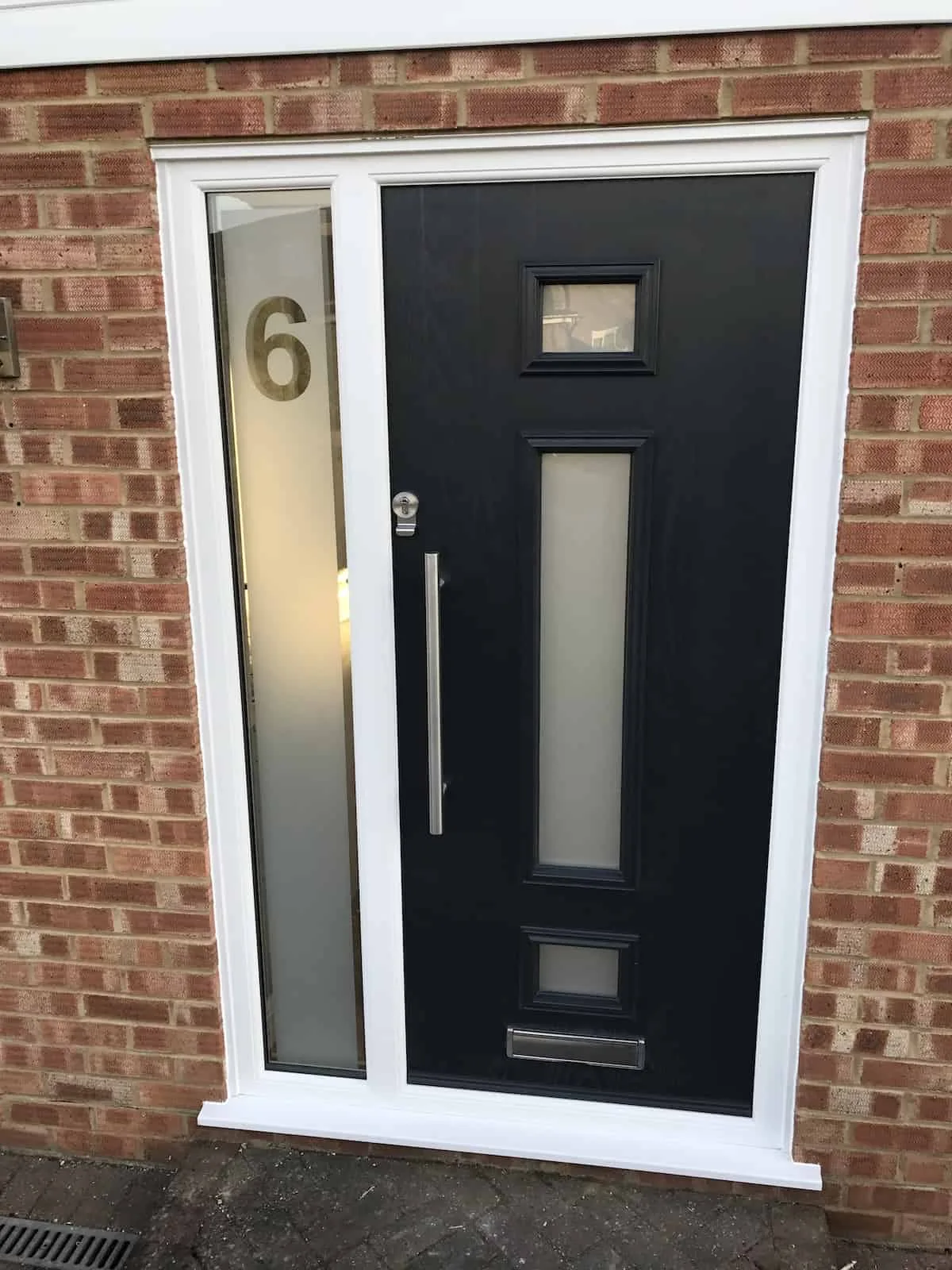 Black composite front door with side window, real customer installation