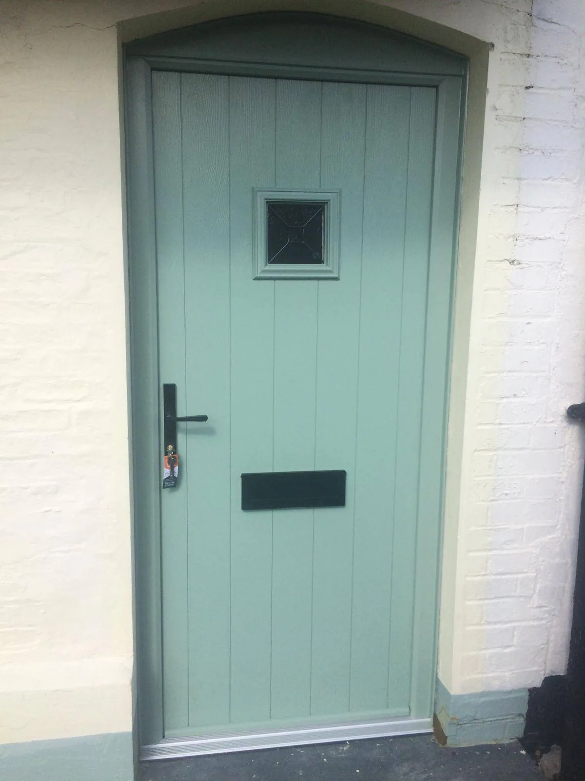 Chartwell green composite front door with decorative glass, real customer installation