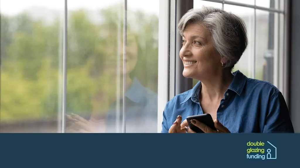Woman sitting in front of a casement window
