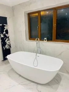 Bathroom refit in progress with new bath, real project photo