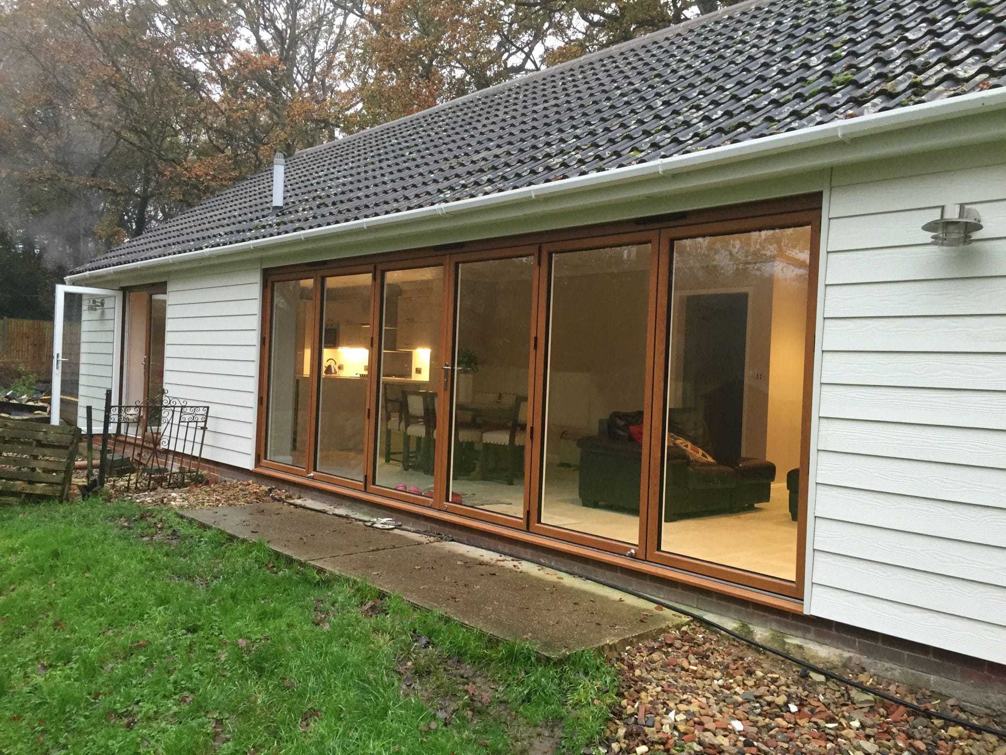 Large Golden Oak Bifold leading to garden