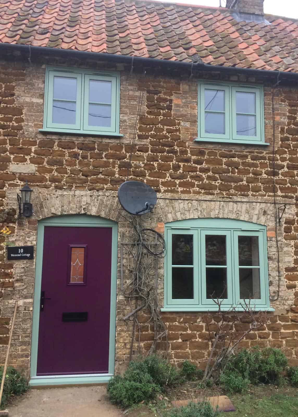 Chartwell green double glazed windows with a purple front door